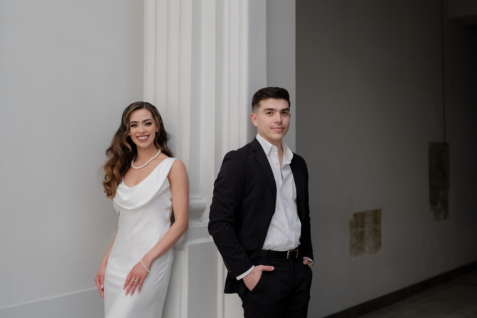 Kelsey and Jose Elias in an elegant doorway